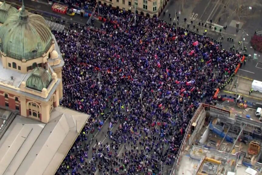 An aerial shot of thousands of people protesting in Melbourne.