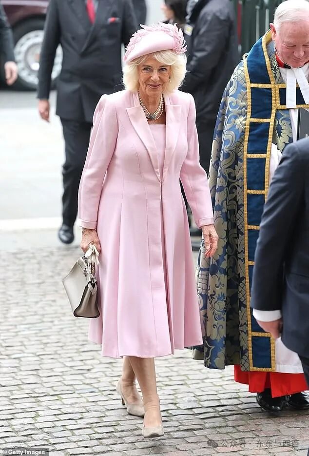 Queen Camilla walks into the annual Commonwealth Day service at Westminster Abbey today