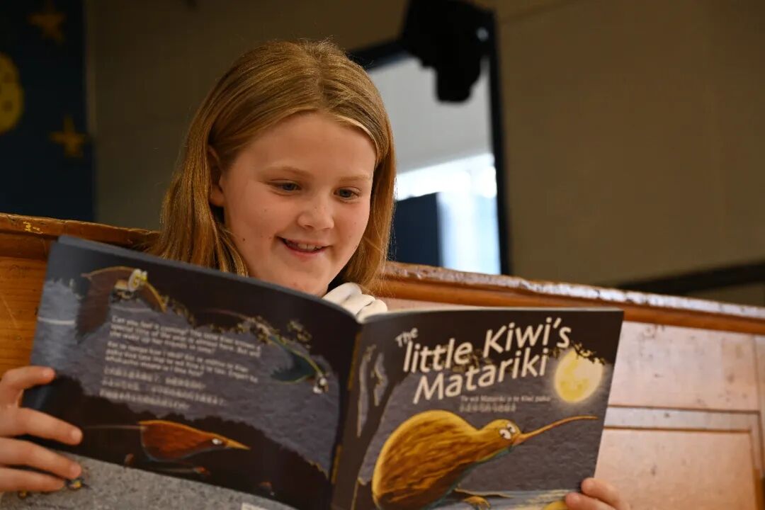 A child reading a book
AI-generated content may be incorrect.