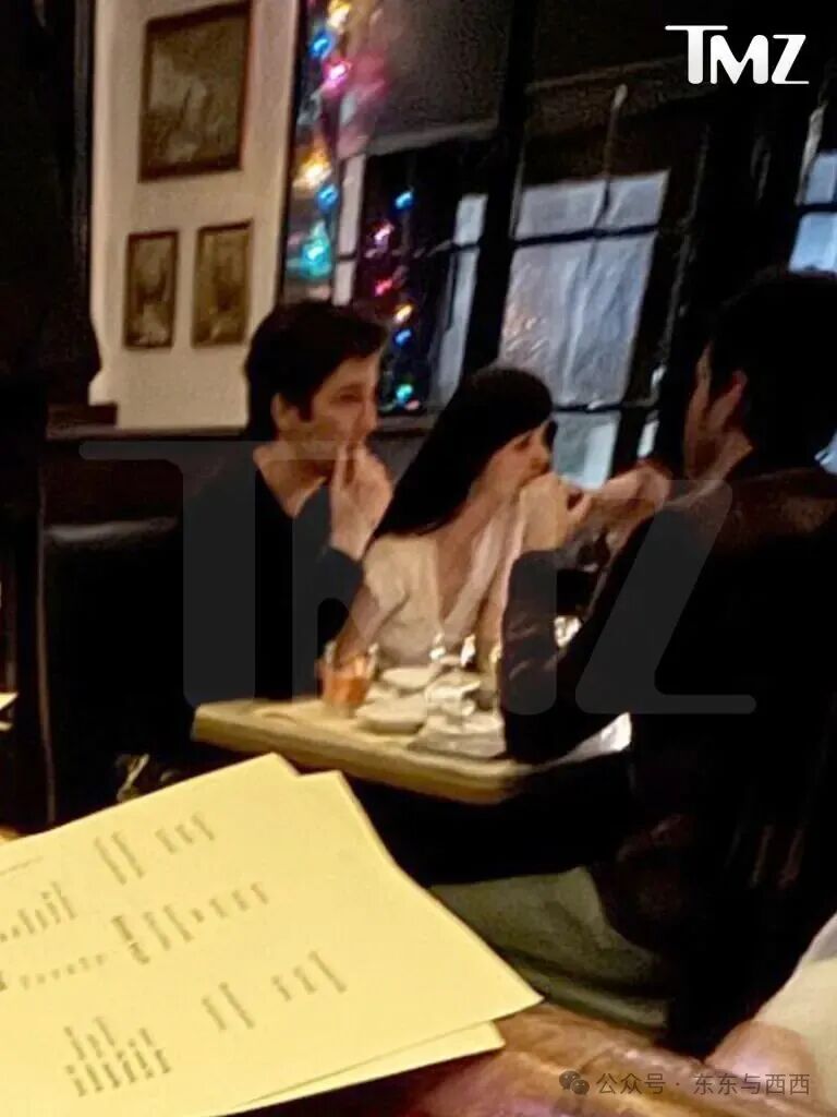Dakota Johnson and Tucker Pillsbury at a dinner table.