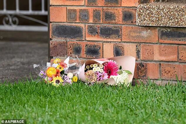 Floral tributes were seen outside Chris Baghsarian's home in North Ryde on Wednesday