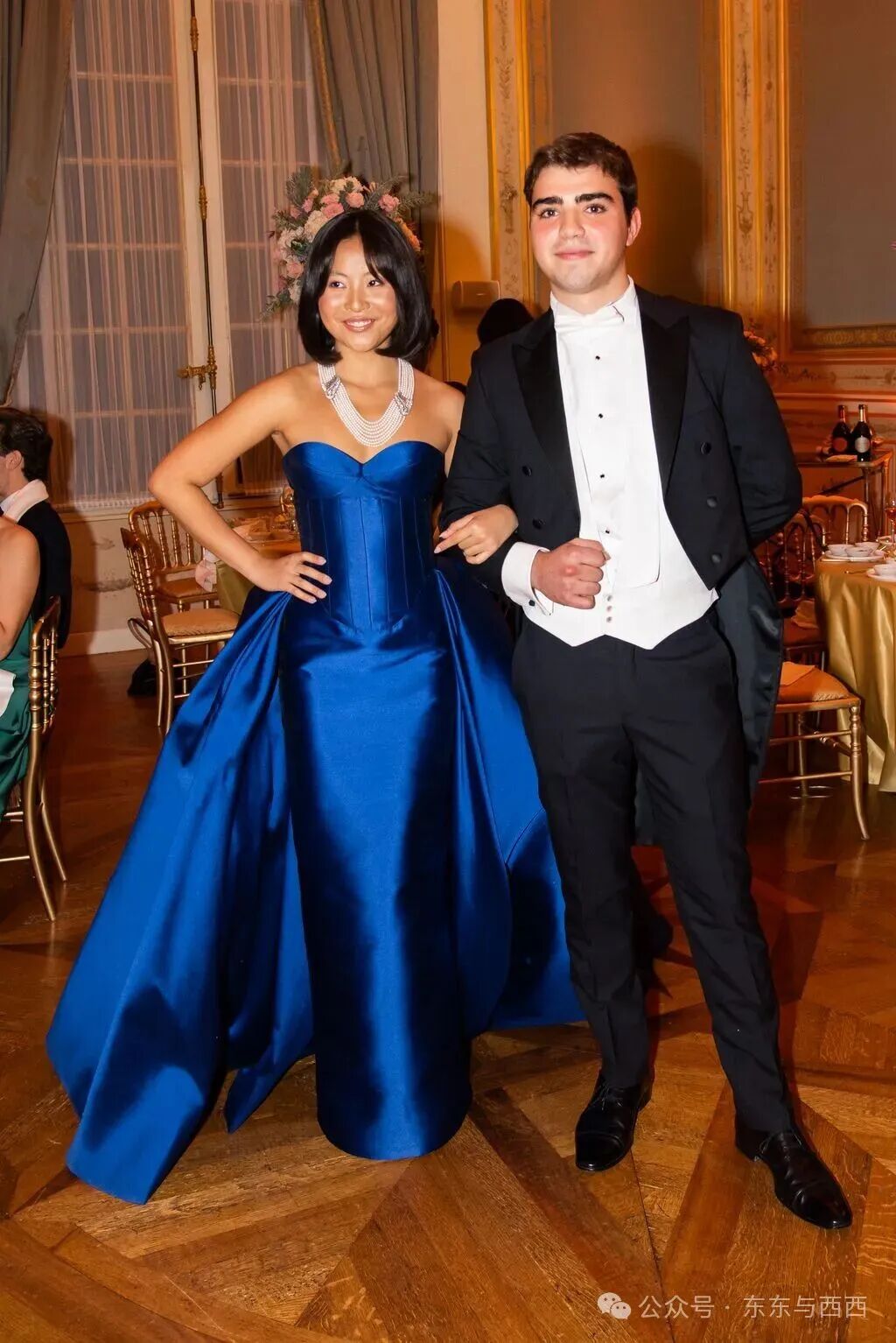 Image may contain Formal Wear Blazer Clothing Coat Jacket Dress Suit Tuxedo Fashion Gown Evening Dress and Adult