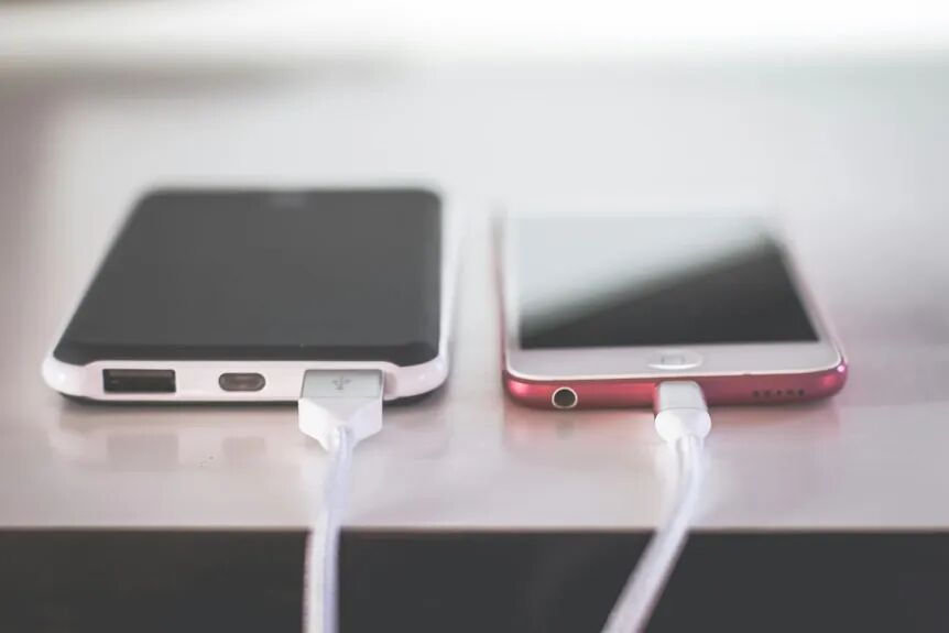 A close-up view of a phone charging on a power bank