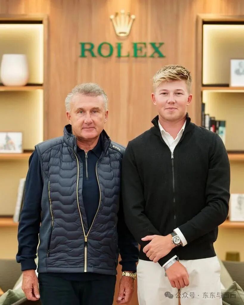 harry charles posing in front or rolex sign