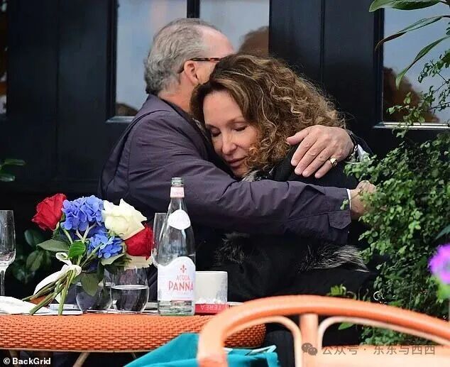 The couple also lovingly embraced as they dined al fresco style in the chilly London weather