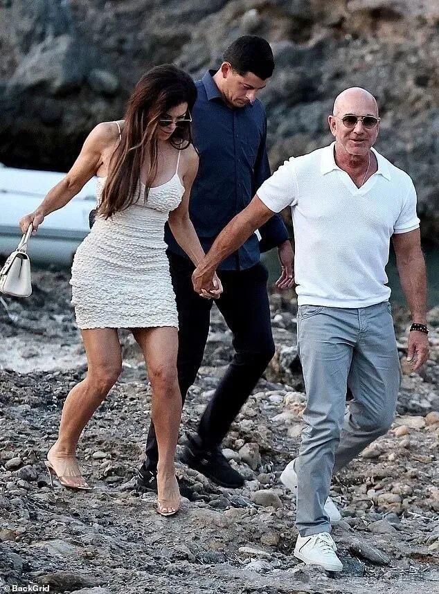 Her husband, 61, kept it simple in a white polo shirt, grey trousers and white trainers, slightly more apt for the rocky short.