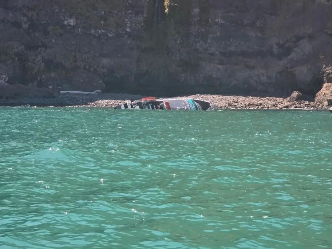 The boat has capsized off the coast of Akaroa. Photo / Supplied